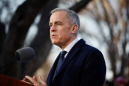 Canada's Prime Minister Mark Carney speaks to the media at Ritan Park, during the first visit by a Canadian prime minister to China since 2017, in Beijing, China, January 16, 2026. REUTERS/Carlos Osorio