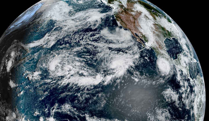 Three tropical systems were active in the central and eastern Pacific Ocean on Wednesday. Tropical Depression 15E was south of Hawaii, Hurricane Polo was near Mexico and Hurricane Odalys was between the two in the open ocean. (CSU/CIRA & NOAA)