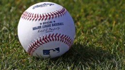 A baseball on grass
