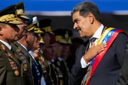 Venezuela’s President Nicolas Maduro places his hand over his hear while talking to high-ranking officers during a military ceremony on his inauguration day for a third term, in Caracas, Venezuela, Jan. 10, 2025. (AP Photo/Ariana Cubillos, File)