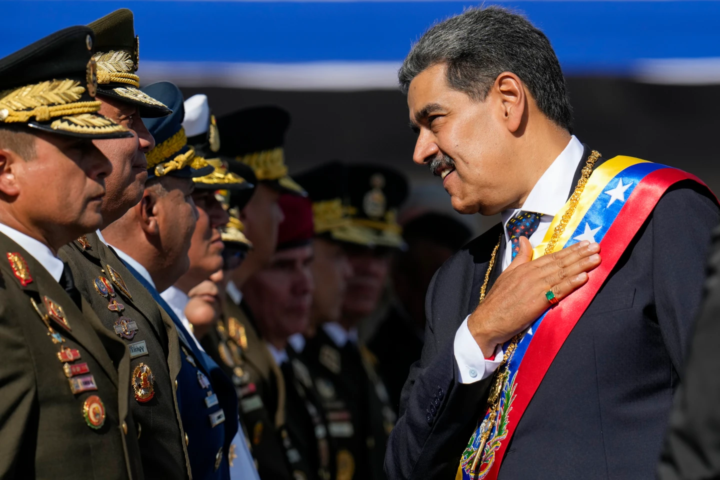 Venezuela’s President Nicolas Maduro places his hand over his hear while talking to high-ranking officers during a military ceremony on his inauguration day for a third term, in Caracas, Venezuela, Jan. 10, 2025. (AP Photo/Ariana Cubillos, File)