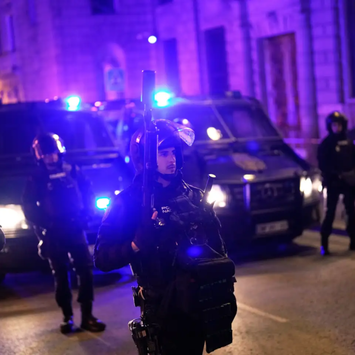 Police officers cordon off the area as protesters gather after the reported death of María del Carmen Abascal, the 87-year-old woman whose eviction sparked nationwide protests, outside Parliament in Madrid, Wednesday, Oct. 7, 2026. (AP Photo/Bernat Armangue)